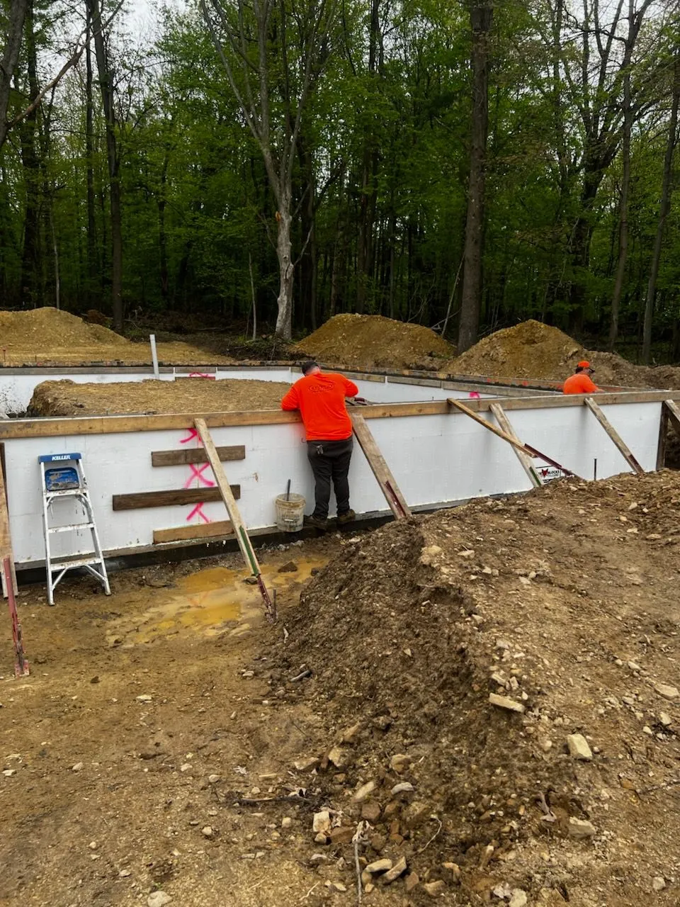 ICF foundation walls with bracing in wooded lot