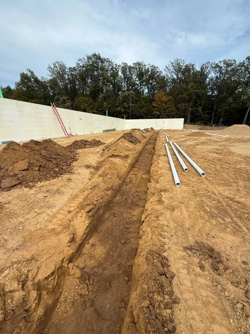 Trenched footings with PVC sewer lines staged