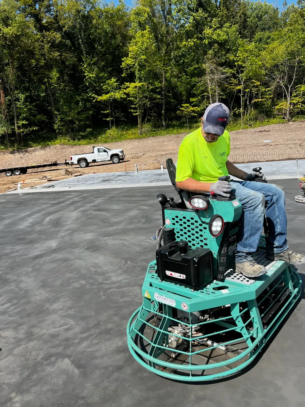 Power-troweling fresh concrete slab