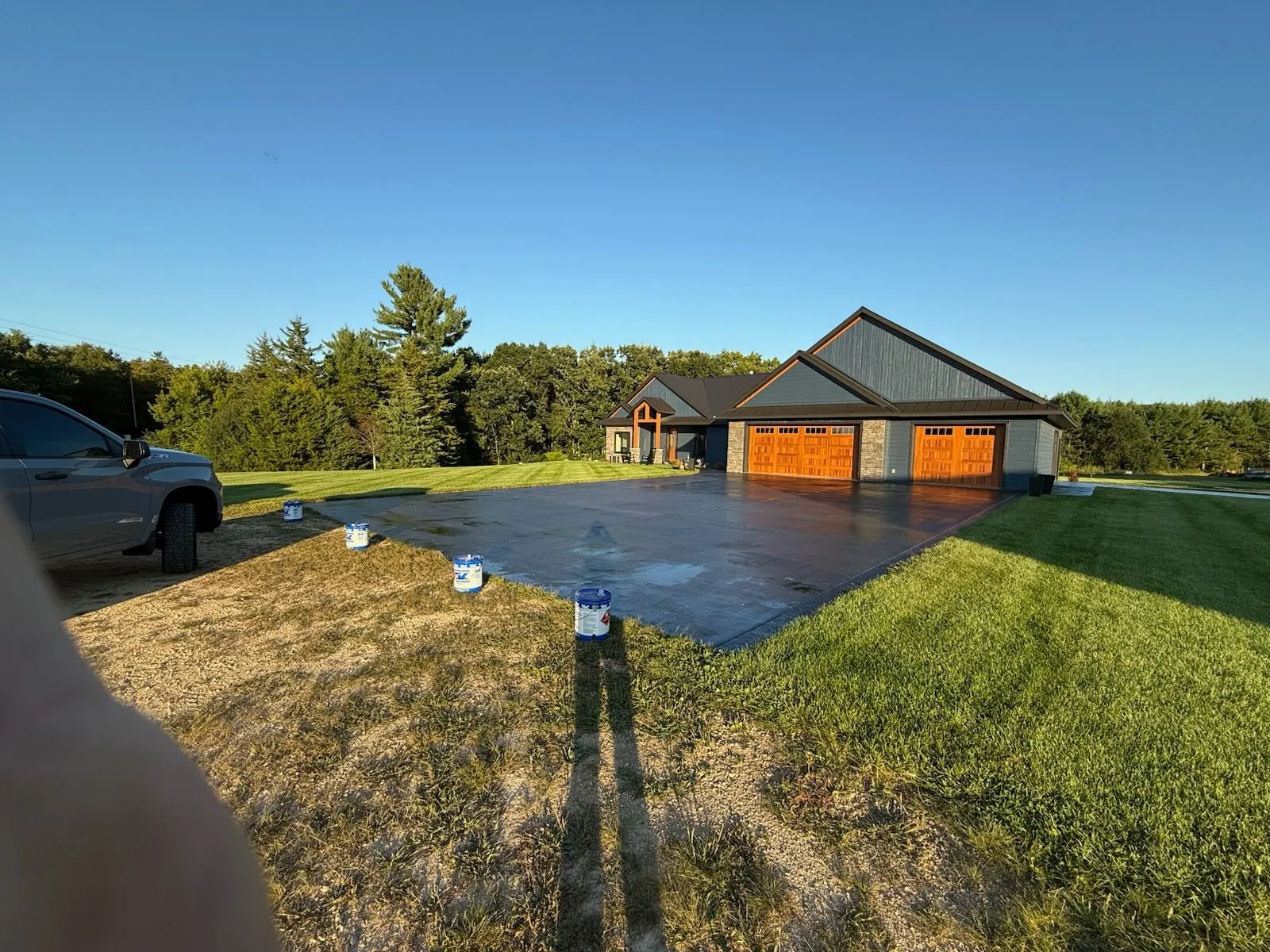 Sealed driveway at custom home with three-car garage